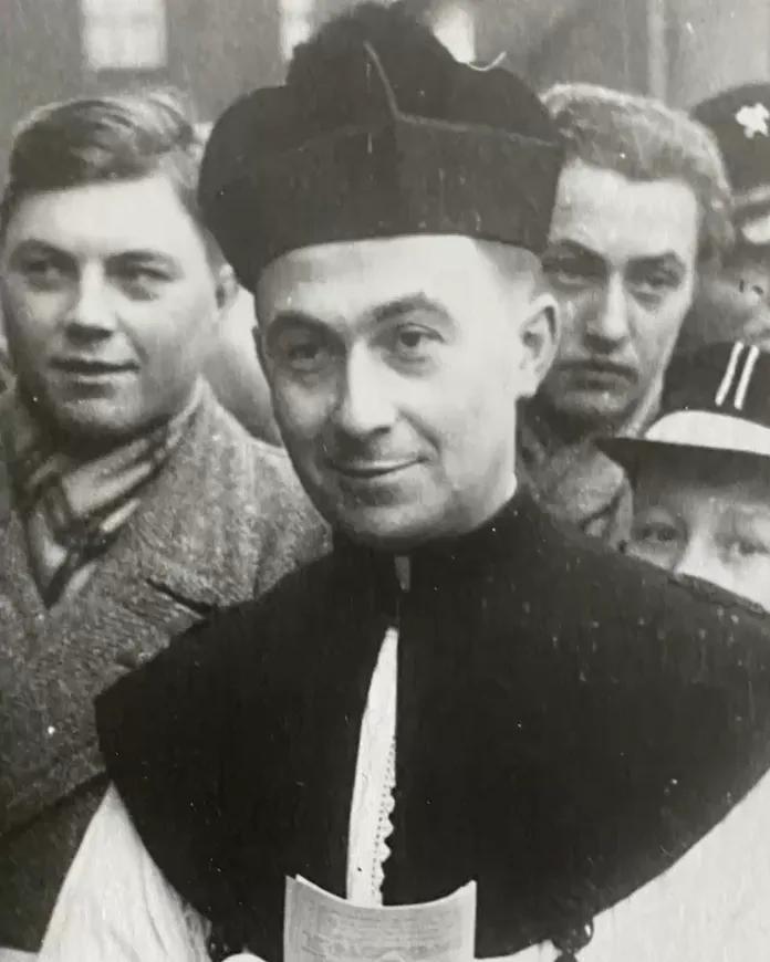 The original photograph before restoration, faded and without colour